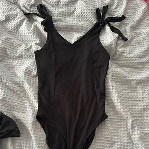Elegant Black Bodysuit with Playful Bow Straps
